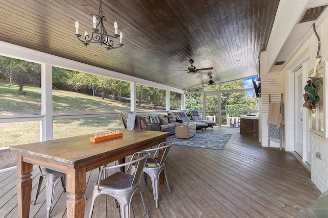 sunroom / solarium featuring ceiling fan, wood ceiling, and vaulted ceiling