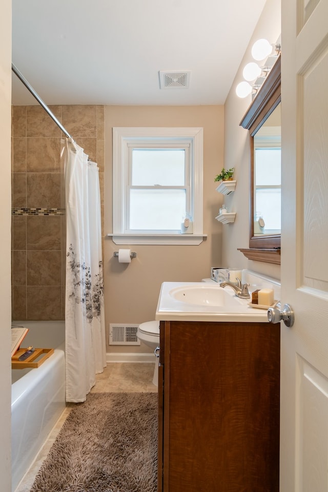 full bathroom with vanity, toilet, tile patterned floors, and shower / bath combo with shower curtain