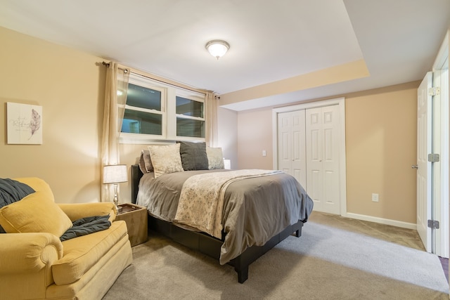 carpeted bedroom with a closet