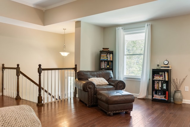 sitting room featuring a wealth of natural light, dark hardwood / wood-style flooring, and ornamental molding