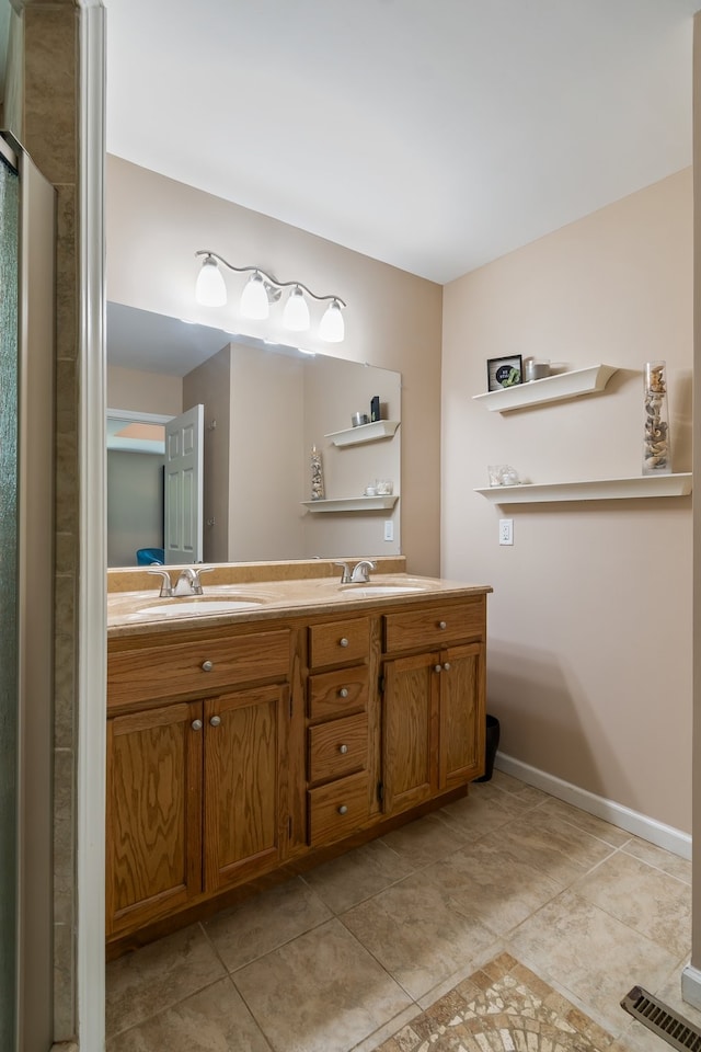 bathroom with vanity and tile patterned floors