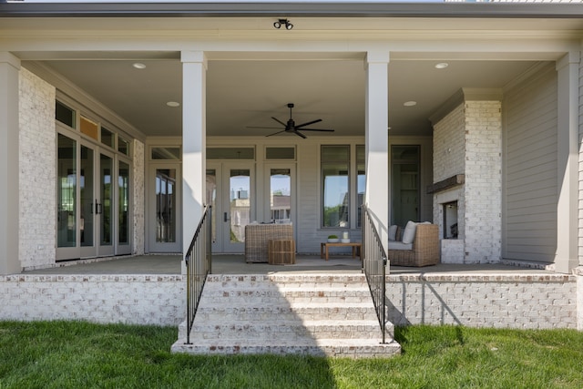 entrance to property featuring french doors and ceiling fan