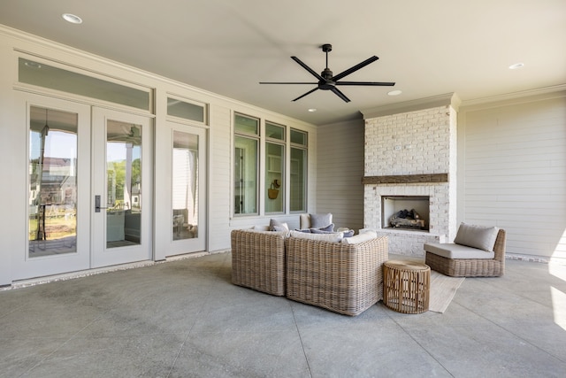 view of patio with ceiling fan, an outdoor living space with a fireplace, and french doors