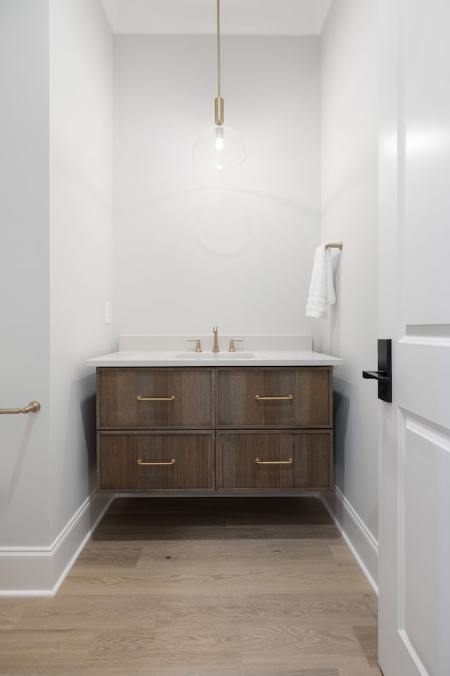 bathroom featuring vanity and hardwood / wood-style floors