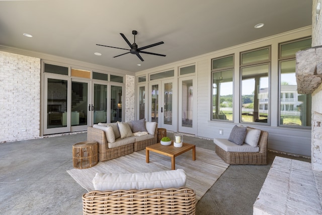 sunroom featuring ceiling fan