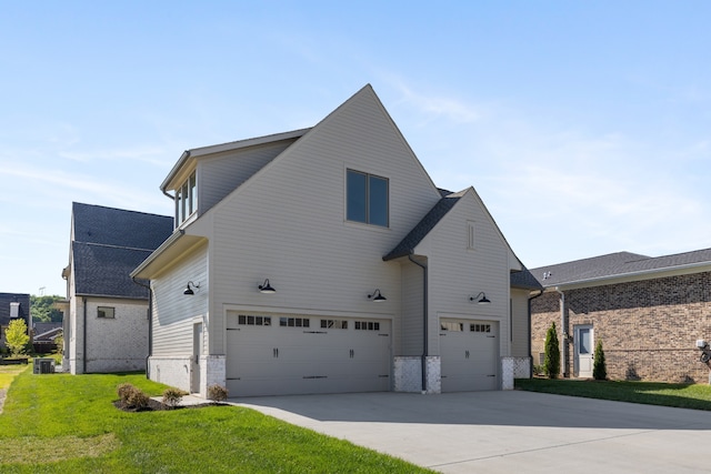 view of side of property featuring cooling unit, a garage, and a lawn