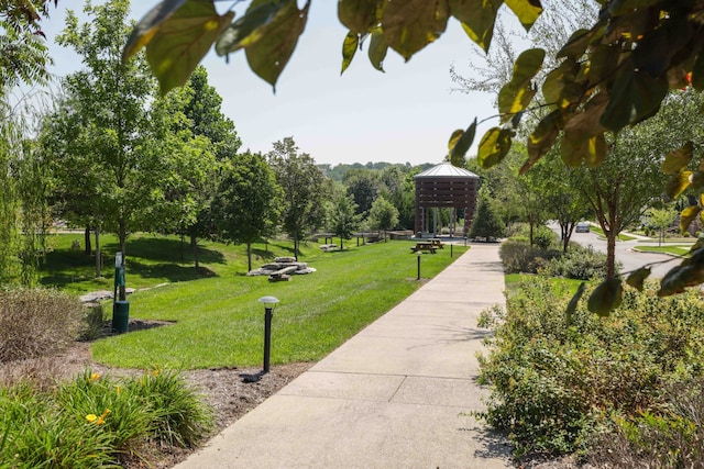 view of property's community with a lawn and a gazebo