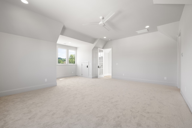 interior space with light colored carpet and ceiling fan