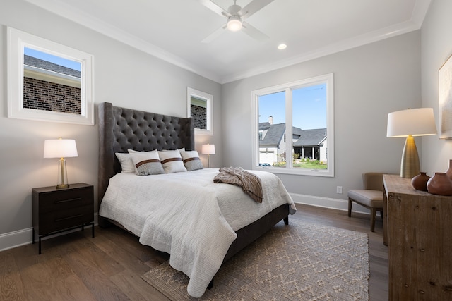 bedroom featuring dark wood-type flooring, ceiling fan, and ornamental molding