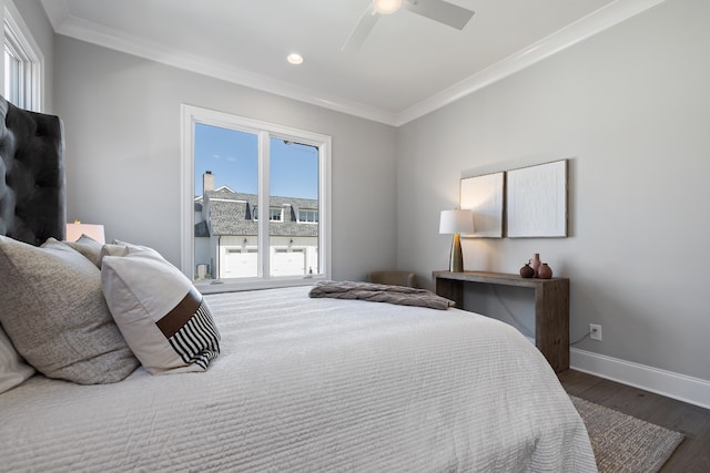 bedroom with multiple windows, ceiling fan, dark hardwood / wood-style floors, and crown molding