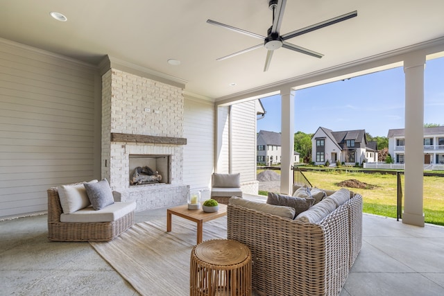 exterior space with an outdoor brick fireplace, ceiling fan, a wealth of natural light, and ornamental molding