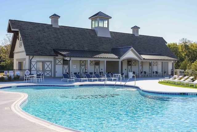 view of swimming pool featuring a patio area