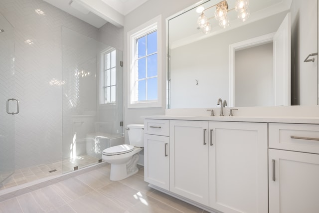 bathroom with a shower with door, vanity, toilet, and tile patterned flooring