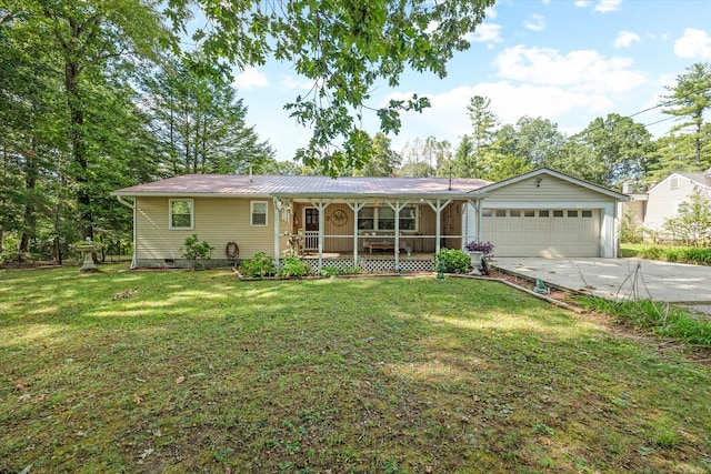 ranch-style home with covered porch, a garage, and a front lawn