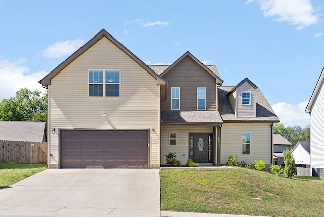 view of front facade with a garage and a front yard