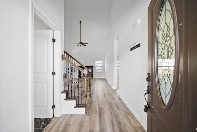 foyer featuring light hardwood / wood-style flooring and ceiling fan