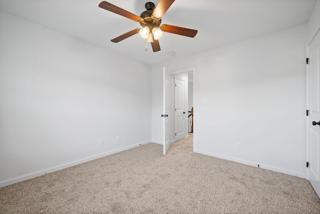 unfurnished bedroom featuring light colored carpet and ceiling fan