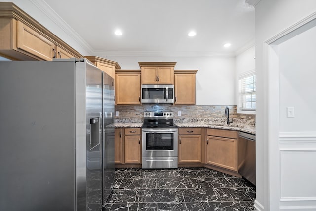 kitchen with backsplash, appliances with stainless steel finishes, light stone countertops, and sink