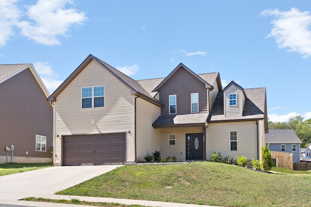 view of front of property with a garage and a front yard