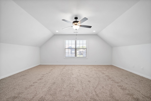 additional living space featuring lofted ceiling, ceiling fan, and light carpet