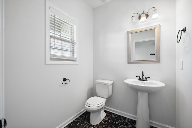 bathroom featuring toilet