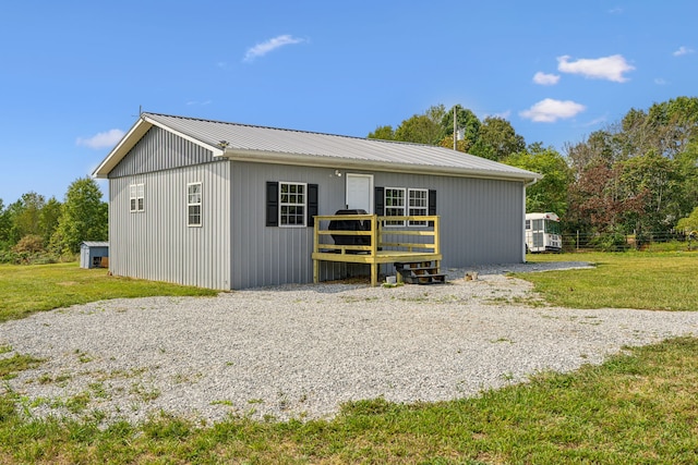 view of outbuilding featuring a yard