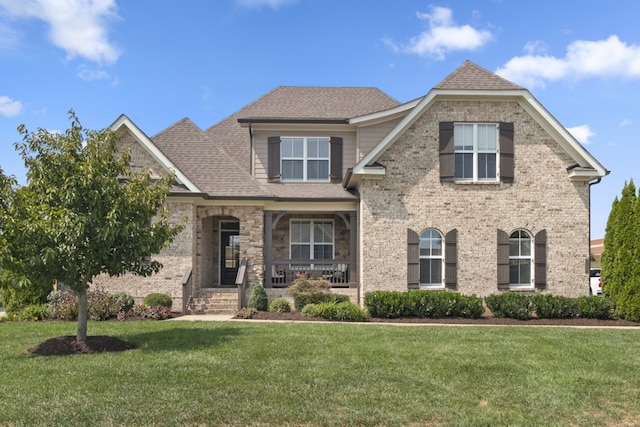 view of front of property with a front lawn and a porch