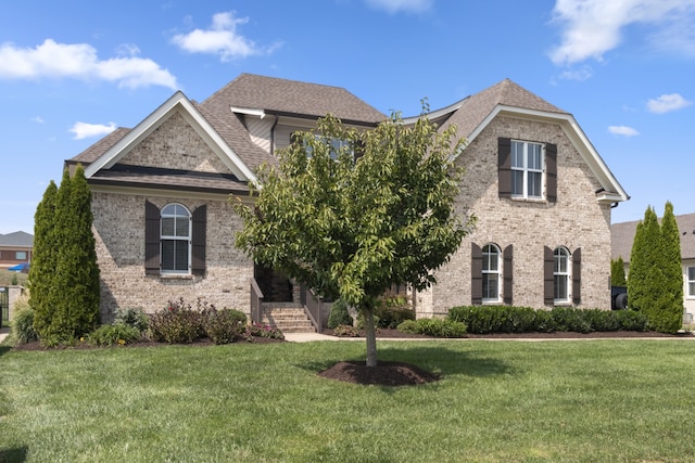 view of front of property with a front lawn