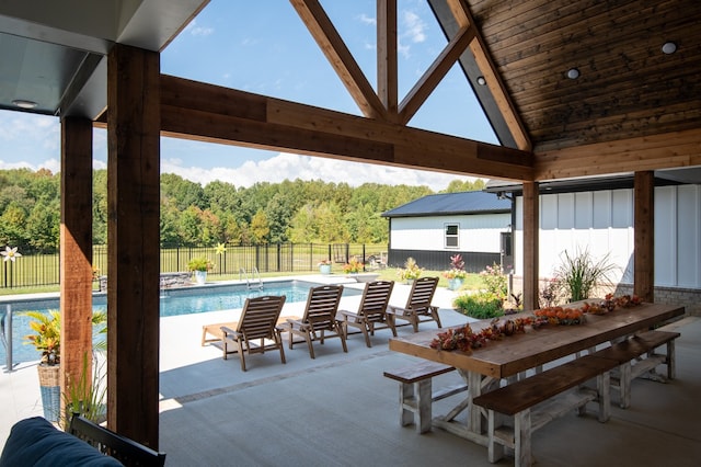 view of patio / terrace with a fenced in pool