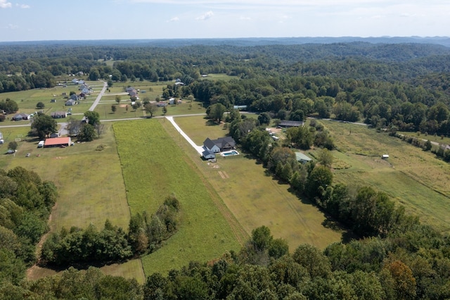 birds eye view of property with a rural view