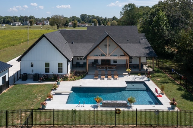 exterior space with a yard, a fenced in pool, and a patio