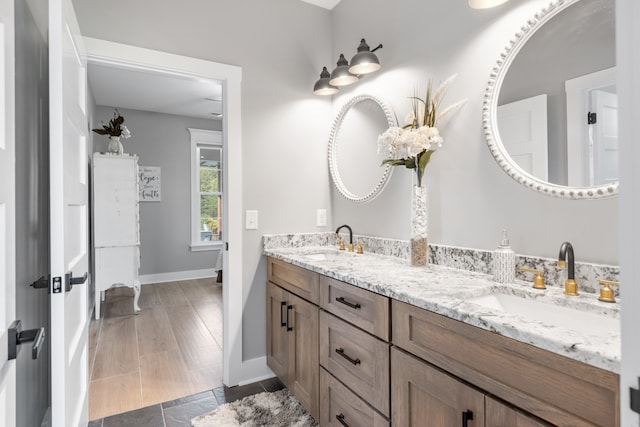 bathroom featuring hardwood / wood-style flooring and vanity