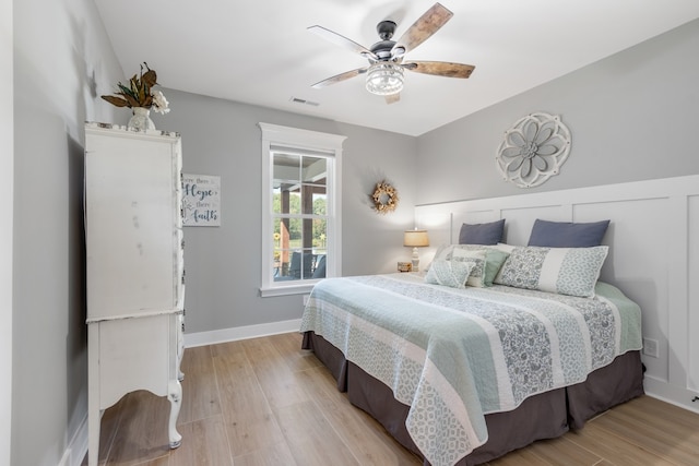 bedroom with ceiling fan and light wood-type flooring