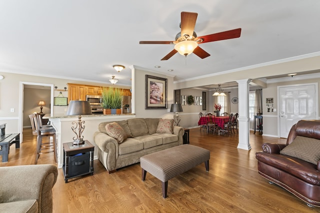 living room with ornamental molding, ceiling fan, ornate columns, and light hardwood / wood-style floors