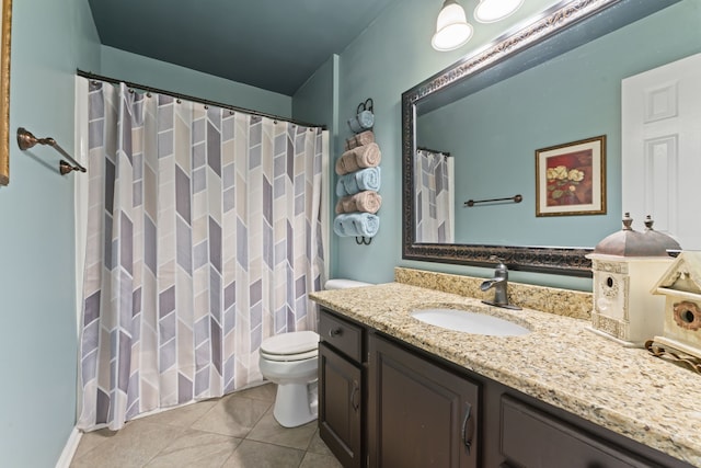 bathroom with vanity, toilet, walk in shower, and tile patterned floors