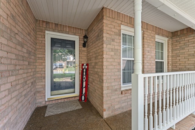 property entrance featuring a porch