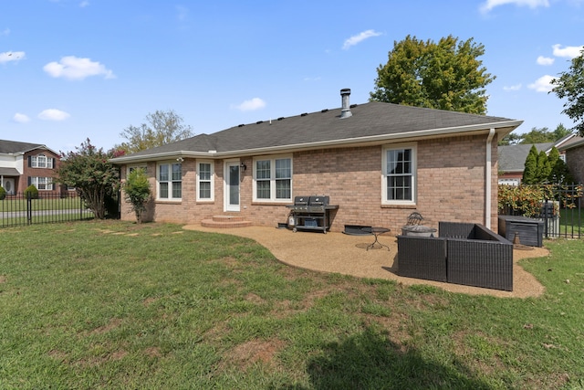 rear view of house with a patio area and a lawn