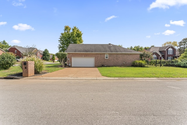 view of front facade with a front lawn and a garage