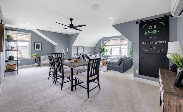 dining room featuring ceiling fan, light carpet, and a wealth of natural light