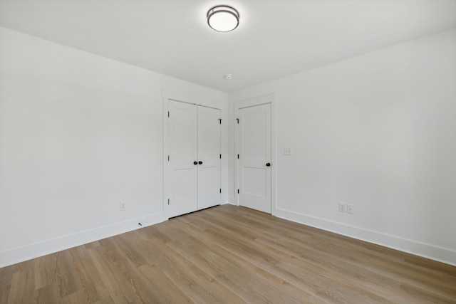 spare room with light hardwood / wood-style floors