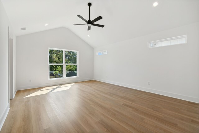 unfurnished room featuring light hardwood / wood-style flooring, ceiling fan, and vaulted ceiling