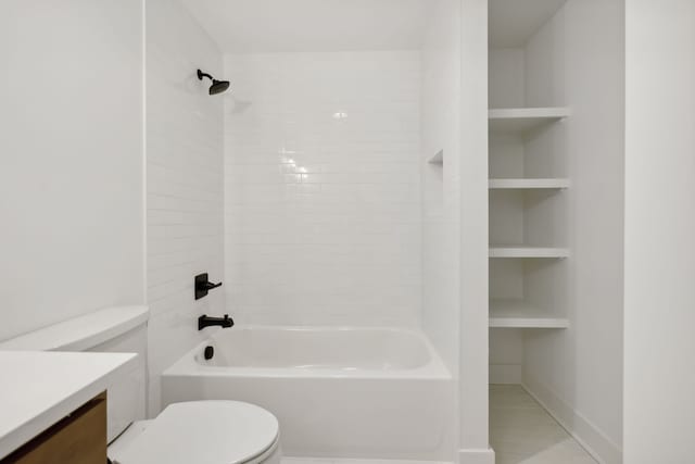 full bathroom featuring tile patterned flooring, toilet, tiled shower / bath combo, and vanity