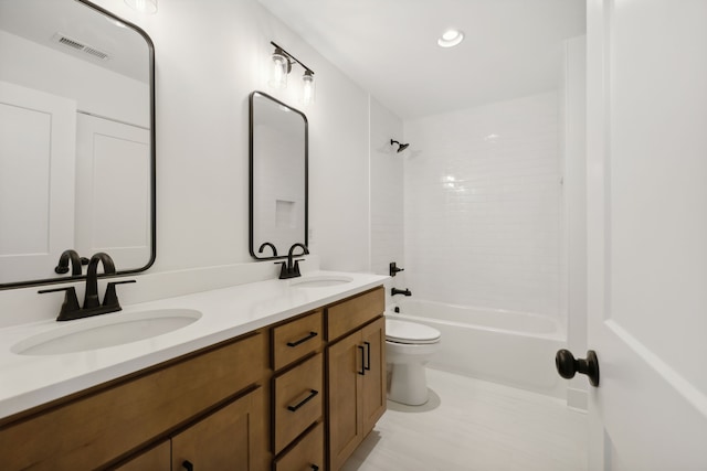 full bathroom featuring vanity, toilet, and  shower combination