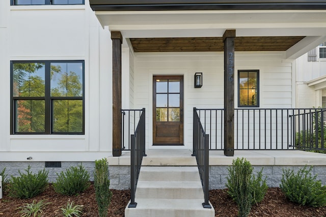 doorway to property with covered porch