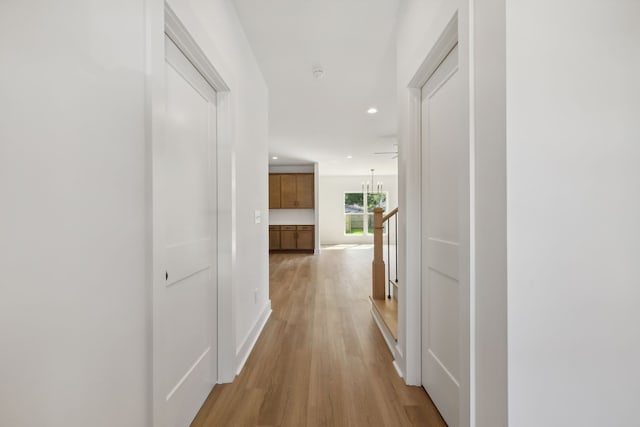 hallway with light wood-type flooring