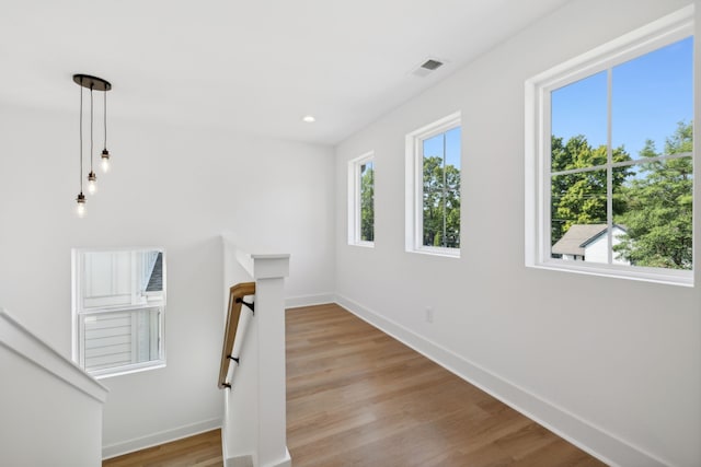 stairs with hardwood / wood-style flooring