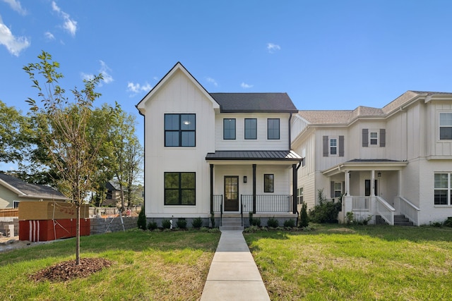 view of front facade with a front yard and a porch