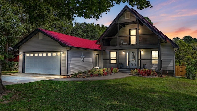 view of front facade with a garage and a lawn