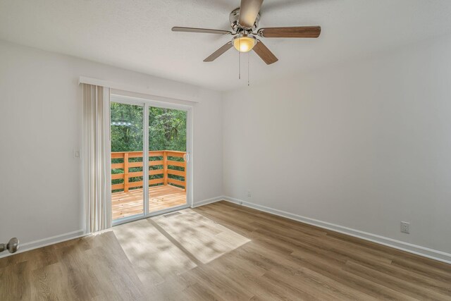 unfurnished room featuring hardwood / wood-style flooring and ceiling fan