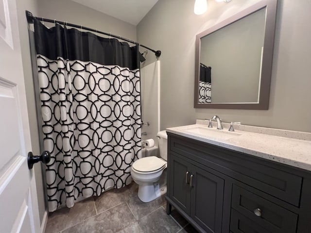 bathroom with vanity, toilet, and walk in shower